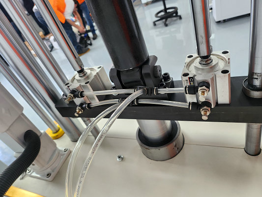 Pneumatic clamping the shock absorber specimen